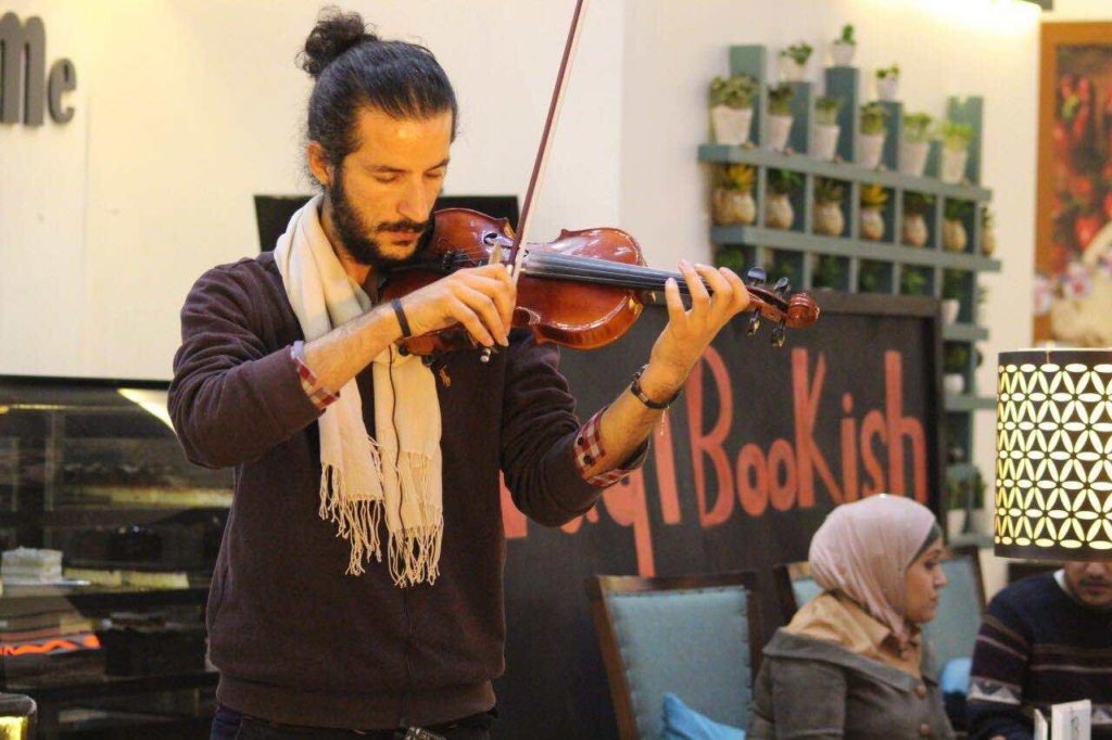 Playing music at the reading club Iraqi Bookish in Baghdad