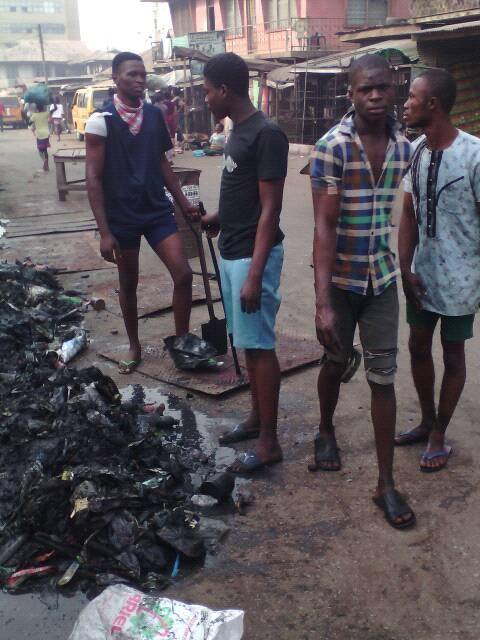 Chris and his neighbors at the cleanup in Onitsha (Nigeria)